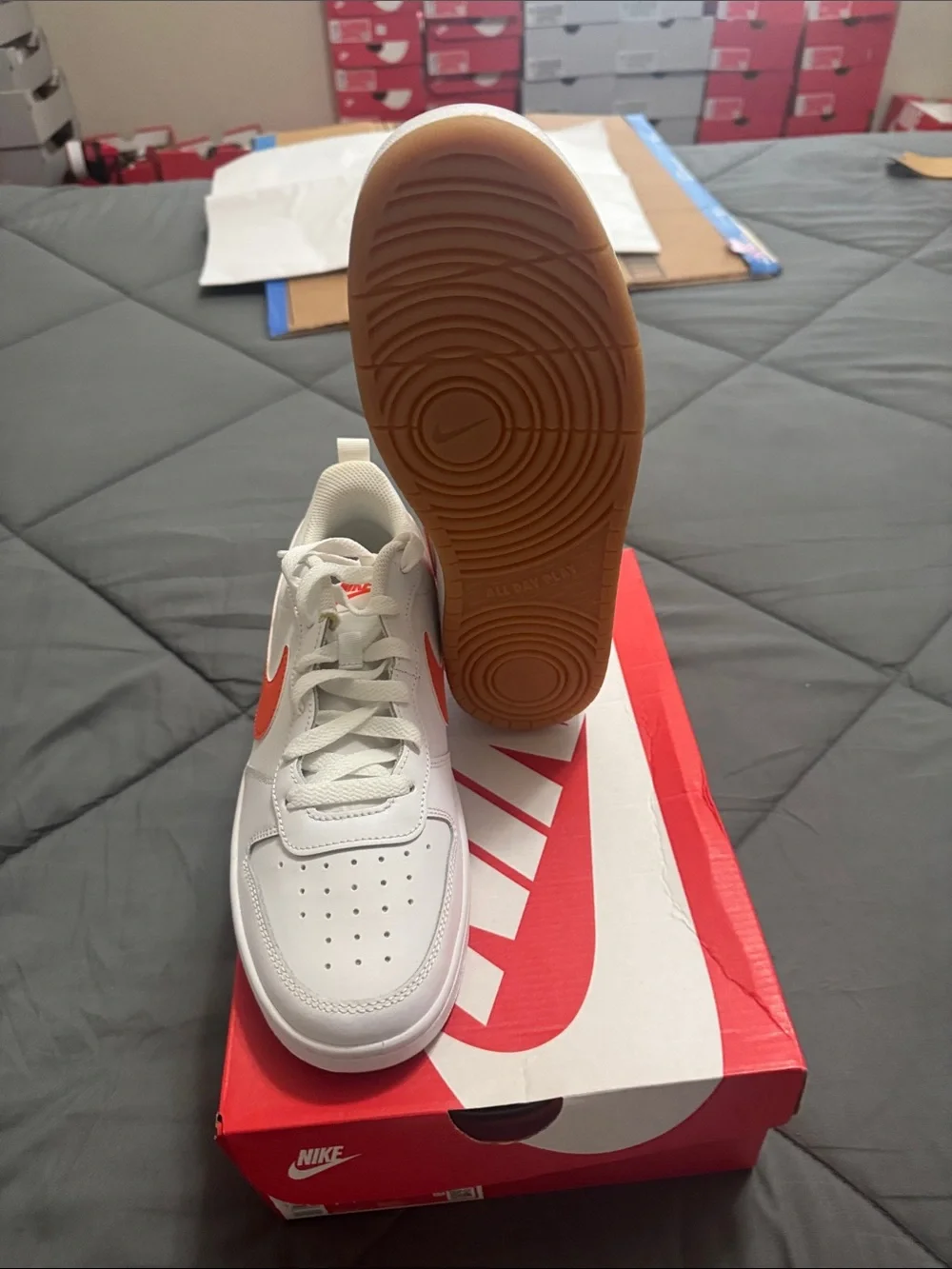 Nike Kids White Sneakers with Orange Swoosh Accent